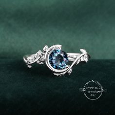 a ring with a blue stone in the center