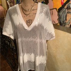 This Is A Fun And Jazzy Sequin Top. This Silver And White Top Can Be Paired With Many Pieces. Trimmed Neckline And Sleeves . 100% Polyester. Trendy V-neck Sequin Top, Spring V-neck Tops With Sequins, Spring V-neck Sequin Tops, Casual Sequined V-neck Top, Casual V-neck Sequined Tops, White Tops For Summer Night Out, White Stretch Sequined Tops, White Stretch Top With Sequins, White Sequined Stretch Tops