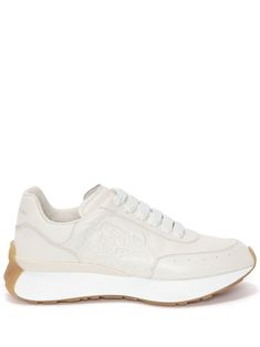 Sprint Runner low-top sneakers from Alexander McQueen featuring vanilla white, white, sheepskin, embossed logo to the side, logo-print tongue, almond toe, front lace-up fastening, branded leather insole, contrasting branded heel counter and oversize rubber sole. Embossed Seal, Alexander Mcqueen Sneakers, Mcqueen Sneakers, Sneaker Lovers, Seal Logo, Brown Sneakers, Embossed Logo, White White, Online Shopping Clothes