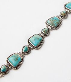 Handcrafted by artisans, this stunning bracelet is made of turquoise stones encased in sterling-silver twist wire rope. Elegant Sterling Silver Bracelet With Turquoise, Turquoise Bracelets, Southwest Jewelry, Navajo Jewelry, Jewellery Making Materials, Handcrafted Bracelets, Twisted Wire, Turquoise Stones, Stone Bracelet