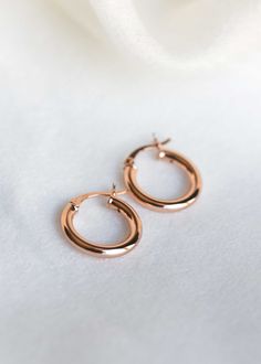 Minimalist Rose Gold Hoops in 18k rose gold vermeil DETAILS * Material: 18k Rose Gold Vermeil Nickel Free * Handmade in our sunny Houston studio What is Gold Vermeil? - The thickness of gold coating in vermeil jewelry is much more substantial than the flash or regular gold-plated jewelry, ensuring deeper long-lasting color and excellent durability. Today, vermeil is the choice of most fashion-savvy women for its unique balance of cost and quality. Also, our gold vermeil is nickel-free and is saf Dainty Rose Gold Tarnish-resistant Huggie Earrings, Minimalist 14k Rose Gold Earrings, Minimalist 14k Rose Gold Huggie Earrings, Classic Rose Gold Hypoallergenic Huggie Earrings, Classic Hypoallergenic Rose Gold Huggie Earrings, Classic Rose Gold Earrings With Polished Finish, Classic Rose Gold Earrings With Shiny Finish, Classic Shiny Finish Rose Gold Earrings, Dainty Rose Gold Hypoallergenic Huggie Earrings