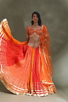 Shop beautiful orange and red lehenga online in USA with gota border and dupatta. Look your best at weddings and parties in Indian dresses, designer lehengas, Anarkali suits, designer gowns, salwar suits, sharara suits from Pure Elegance Indian fashion store in USA.-full view Orange Anarkali Set With Sheer Dupatta, Orange Choli With Pallu For Festivals, Traditional Drape Orange Choli For Navratri, Orange Traditional Drape Set With Dupatta, Orange Sharara With Dupatta For Festivals, Traditional Orange Choli For Navratri, Orange Choli With Sheer Dupatta For Navratri, Orange Choli With Zari Work For Festivals, Orange Sharara With Sheer Dupatta For Navratri