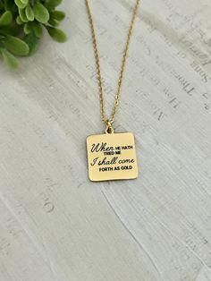 A beautiful gold square bar necklace engraved with "I shall come forth as gold Job 23:10, Christian Women Gifts, Scripture Faith Charms, Motivational Jewelry Charms are gold plated over stainless steel. Plated jewelry is a wonderful, affordable way to add a sophisticated look to your wardrobe, with the look of real gold. It is also an excellent choice for people with sensitive skin. CARE TIPS: Avoid contact with perfumes, body oils, and other chemicals, including household cleaners. Never use ch Gold Personalized Spiritual Charm Necklaces, Personalized 14k Gold Spiritual Charm Necklaces, Spiritual Yellow Gold Initial Pendant Charm Necklace, Job 23 10, Spiritual 14k Gold-filled Charm Necklaces As Gift, Yellow Gold Zodiac Sign Pendant Jewelry, Motivational Jewelry, Engraved Bar Necklace, Engraved Necklace