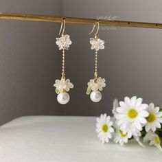 Floral Pearl Dangle earrings, Pearl drop earrings with delicate white flowers, Unique Bridesmaid Earrings, Unique Bridal Party Earrings 🤍 Hypoallergenic 🌸 Handmade with love ✨ Cute & Dainty  🎁 Gift ready 〰️Click👇🏻 Find more Earrings🎀  https://www.etsy.com/shop/byYeeSo ◽️ PACKAGING ◽️  * The jewelry will be nicely packaged * Comes with a drawstring suede pouch * If you need personalized gift note, please click the link below, add it to your cart when check out to upgrade your packaging. https://www.etsy.com/listing/1008661207/upgrade-gift-packaging?ref=shop_home_active_1&frs=1 ◽️ SHIPPING ◽️ * USPS First Class Shipping Service with tracking number * All products will be shipped from USA ◽️ CARE INSTRUCTIONS ◽️ * Avoid perfumes or sprays * Avoid getting your jewelry wet * Wipe down the Bridal Jewelry Pearl Earrings, Bridal Party Earrings, Earrings Pearl Drop, Flowers Unique, Unique Bridesmaid, Pearl Dangle Earrings, Diy Bracelet Designs, Party Earrings, Earrings Pearl