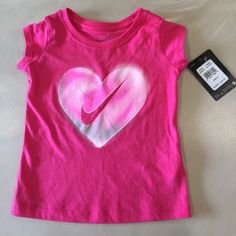 Nwt! Nike T-Shirt. Dark Hyper Pink With Heart Graphic In White, Gray And Pink. Short Sleeves. 100% Cotton. Very Comfortable. Bundle And Save! Size 2t Toddler Girl Shorts, Nike Baby, T Shirt Picture, Girls Shirt, Nikes Girl, Nike Tshirt, Baby & Toddler Clothing, Nike Shirts, Print Logo