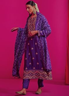 Features a Zari embroidered straight kurta with embroidered booties and a heavy yoke, Teamed with elegant straight pants and a geometrical bandhani silk dupatta. Composition : Kurta and Pants - Silk Chanderi, Dupatta- Silk Care: Dry Clean Only and Vacuum Storage This product can be customised for sleeves, length of blouse and neckline Delivery : 4-6 weeks as the product is hand crafted. For more information and sizes please contact fabiliciousfashion@gmail.com or visit our Copenhagen studio.Abou Luxury Bollywood Bandhani Print Dupatta, Luxury Festive Bandhani Print Dupatta, Kurta And Pants, Chanderi Silk Suits, Bandhani Dupatta, Chanderi Dupatta, Vacuum Storage, Pink City, Wedding Saree Indian