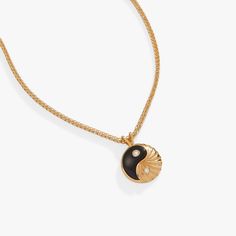 Just as day turns to night, dark and light hold in eternal balance, maintaining a sacred symmetry. This Black Onyx Yin Yang necklace, in 14kt gold plate, is a wearable symbol of that divine balance. The yin yang charm, one half black onyx and one half textured gold plate, has sparkling cubic zirconia accents on both sides. On the back, the charm says “strength and intuition,” as a reminder that it all comes from within. This necklace is adjustable between 18” and 20”. Chain length: 20", adjusts Ying Yang Jewelry, Yin Yang Jewelry, Yin Yang Charm, Yin Yang Necklace, One Half, Charm Bangle, Adjustable Necklace, Charm Gift, Shiny Silver