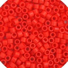 red plastic beads with holes in the middle