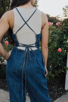 Description Wide Leg Denim Jumpsuit. Criss Cross tie back detail. Materials & Care Shell 100% cotton Hand wash cold, do not bleach, do not tumble dry, hang dry Hand Measured Small: Inseam 25.5" Waist 12.5 (25)" Medium: Inseam 26" Waist 13(26)" Large: Inseam 26.5" Waist 13.5(27)" Model is wearing a size small Model pictures have been edited, please refer to video for actual color reference. Studded Ankle Boots, Herringbone Blazer, Ruffle Jacket, Color Reference, Maxi Shirts, Boot Straps, Twill Jacket, Cowgirl Hats, Pleated Pants