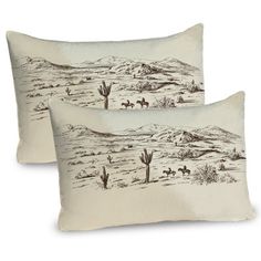 two pillows with desert scene on them