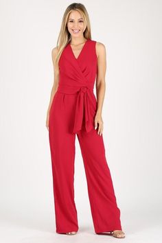 Solid Sleeveless Essential Jumpsuit in Red Sleeveless Belted Jumpsuits And Rompers, Belted Sleeveless Jumpsuits And Rompers For Date Night, Sleeveless Belted Jumpsuit For Date Night, Sleeveless Jumpsuits And Rompers With Tie Waist For Party, Spring Workwear Jumpsuit With Surplice Neckline, Chic Sleeveless Jumpsuits And Rompers With Tie Waist, Sleeveless Tie Waist Jumpsuit For Date Night, Sleeveless Tie-waist Jumpsuits For Date Night, Elegant Spring Jumpsuits And Rompers With Surplice Neckline