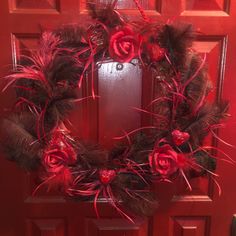 a red door with a wreath on it