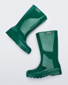 Meet Welly. Melissa’s take on galoshes, these bubble-gum scented boots will let you splish-splash around in waterproof style. On those chance-of-rain-or-sleet days, don’t forget Welly. Made of 100% Melflex PVC, they’re recyclable and sustainable to boot! Green Rain Boots, Punk Love, Punk Movement, Splish Splash, Viktor & Rolf, Style Upgrade, Jelly Shoes, Rain Boot, Quirky Design