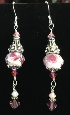 Absolutely stunning pink Swarovski crystal earrings.  The ear wires are sterling and the earrings also have pewter and more sterling. They are almost 2 1/2 inches long but are very lightweight. Elegant Pink Czech Glass Earrings, Elegant Pink Sterling Silver Crystal Earrings, Pink Sterling Silver Drop Crystal Earrings, Pink Sterling Silver Crystal Earrings As Gift, Pink Czech Glass Earrings With Ear Wire, Nickel-free Pink Crystal Earrings In Sterling Silver, Nickel-free Pink Sterling Silver Earrings, Pink Czech Glass Pierced Earrings, Handmade Pink Crystal Sterling Silver Earrings