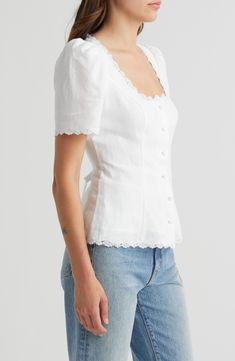 Princess seams shape a top of pure linen edged in scalloped lace and finished with fabric-covered buttons. 24" length Front button closure Sweetheart neck Short sleeves Partially lined 100% linen Machine wash, dry flat Imported White Linen Square Neck Top, Feminine Blouse With Lace Trim And Square Neck, Feminine Square Neck Blouse With Lace Trim, Fitted Square Neck Top With Lace Trim, Fitted Square Neck Tops With Lace Trim, Elegant Linen Tops With Button Closure, Fitted Cotton Tops With Scalloped Edges, Elegant Linen Tops With Buttons, Fitted Linen Tops With Buttons