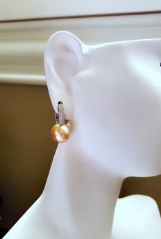 High quality perfect round saltwater cultured Southsea pearl post earrings, rare to find natural medium-deep gold color, untreated, non-dyed *Made with top quality AAA grade almost flawless cultured Southsea pearls and solid 18Kt white gold with cubic zirconia. Safe for sensitive skin. * 11.3mm pearls. *Leverback closure. * Other pearl size available, message me for a quote *All my pieces are safely packed in a gift presentation box. See other design in my store: http://www.etsy.com/shop/JWJewel Hypoallergenic Round Pearl Earrings For Formal Occasions, Round High Luster Pearl Earrings For Formal Occasions, High Luster Pearl Earrings For Formal Occasions, Formal High Luster Round Pearl Earrings, Round Pierced Pearl Earrings For Formal Occasions, Pierced Round Pearl Earrings For Formal Occasions, Pearl Clip-on Earrings, Round Pearl Drop Clip-on Earrings For Anniversary, Round Pierced Pearl Earrings For Anniversary