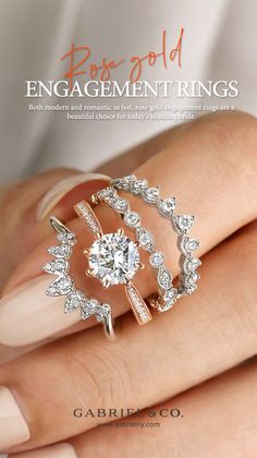 the engagement rings are set on top of someone's hand with their wedding band