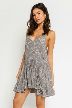 A perfect day starts with the Swing By Silver and Mauve Boho Print Sleeveless Mini Dress! Lightweight rayon fabric, with a silver grey, and mauve boho print throughout, shapes adjustable spaghetti straps, a V-neckline, and a fitted bodice. A zigzagging drop waist tops the flaring skirt before it falls to a mini hem. Lined. DETAILS & CARE Rayon. Machine Wash Cold. Imported. Day Mini Dress, Boho Beach Outfit, Boho Boutique, Grey Lace, Boho Mini Dress, Pink Boho, A Perfect Day, Boho Print, Flowy Skirt