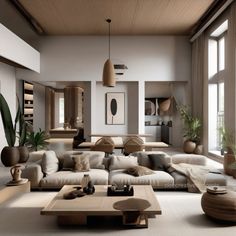 a living room filled with lots of furniture and large windows next to a wall mounted plant