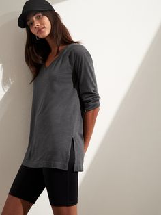 SLUB COTTON MODAL: A customer favorite.  Breathable cotton meets silky soft modal with a subtle texture.  SUSTAINABLE: Made with silky soft TENCEL™ modal, sourced from sustainably managed forests.  RELAXED FIT: Our "Legging Tee".  Expertly cut for a loose fit and longer length.  Wide v-neck.  Center back seam shapes the waist (without flaring out at the sides).  Straight hem with 7" side slits.  Relaxed fit.  3/4 sleeves.  Tunic length.  Body length (size S): Regular 28" Sleeve length from cente Comfortable Relaxed Fit Modal Tops, Effortless Soft-washed Top For Loungewear, Subtle Textures, Tunic Length, Long Length, Banana Republic, Tunic Tops, Loose Fitting, Relaxed Fit