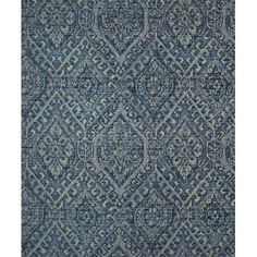 a blue rug with an intricate design on the front and back side, in various colors