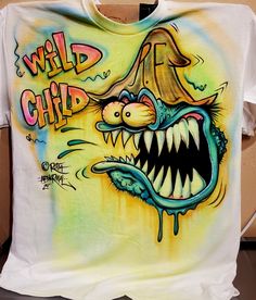 a t - shirt with an image of a cartoon character and the words wild child on it