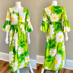 Adorable 1970s Malia Honolulu maxi dress. It is made of a substantial ribbed cotton in green with huge daisies print. It has an empire waist with matching fabric tie belt, fabric covered buttons down the front, 3/4 length puffed sleeves.  Great & clean condition, there are some scattered spots throughout - they are faint and small - some on the back of one of the puff sleeves, one on the fabric belt SIZE : tag size 8, fits like an Xs  Measurements - Bust : 32 Waist : 26 (empire) Hips : 36 Length 1970s Green Floral Print Dress, 1970s Style Green Floral Print Dress, Retro Green Floral Print Maxi Dress, Green Retro Maxi Dress With Floral Print, Retro Cotton Maxi Dress, Vintage Green Maxi Dress For Summer, Green Vintage Maxi Dress For Summer, 1970s Fitted Green Maxi Dress, Green Vintage Dress For Vacation