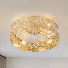 a light that is on the ceiling in a room with white walls and flooring