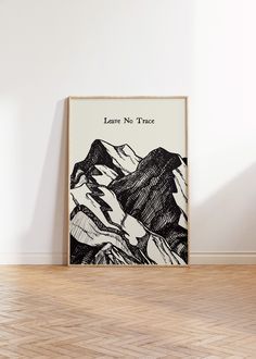 a black and white poster with the words leave no trace on it in an empty room