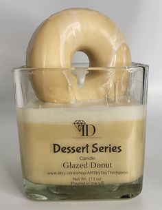 a glazed doughnut sitting in a glass container