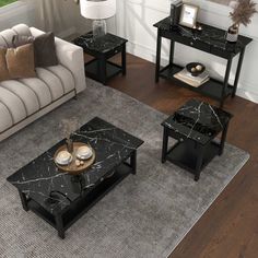 a living room filled with furniture next to a window and a rug on top of a hard wood floor