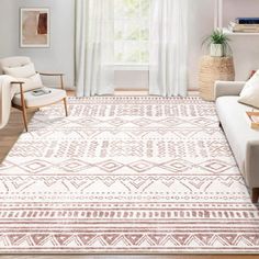 a living room filled with furniture and a white rug