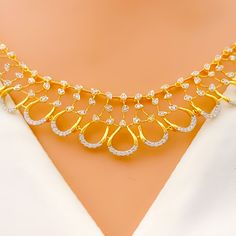 Featuring an 18k yellow gold necklace and matching earrings, this set weighs in at 24.3 grams. It is embellished with diamonds that total 2.07 carats, boasting a G-H color and VS quality, all cut in the round brilliant style. The necklace, measuring 17 inches, is designed with an elegant open drop style and is secured with a lobster lock, including three inches of adjustable links for the perfect fit. The set is accompanied by matching earrings, each 1.25 inches in length, with screw-back posts ensuring secure wear. This bright, open drop set combines classic elegance with contemporary design, making it a stunning addition to any sophisticated ensemble. PRODUCT DETAILS Gold Purity(karat): 18k Item Weight(grams): 24.3 Item Finish: Yellow Gold Stone: Diamond Diamond Weight(carats): 2.07ct Di Bridal Jewelry Necklace, Precious Stones Rings, Diamond Pendant Sets, Modern Bracelets, Fancy Necklace, 18k Gold Necklace, Fancy Rings, Mens Gold Rings, Diamond Necklace Set