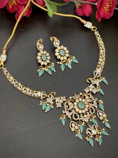 Gorgeous Victorian theme mint color beds peacock Sabyasachi inspired statement Necklace with matching earrings traditional set that goes well with your traditional outfits. Measurements of the earrings: Height of earrings: 5 Cm  Width of earrings: 1.7 Cm  We tried our best to picture the item as close to original as possible. But please be aware of minor variations in shade due to digital picture limitations and screen resolution. Please contact us if you need any further information. Care Instr Festive Bollywood Jewelry Sets With Peacock Design, Festive Peacock Design Jewelry Sets, Traditional Green Kundan Sets, Green Jewelry With Peacock Design For Festivals, Green Kundan Temple Jewelry Set, Festive Traditional Jewelry Sets With Peacock Design, Bollywood Style Peacock Design Jewelry Sets For Festive Occasions, Festive Chandbali Kundan Necklace With Peacock Design, Green Bridal Necklace With Peacock Design For Gift