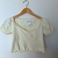 Size Medium/Large Lace Hem And Detailing Never Worn Cute V-neck Loungewear Tops, Cute V-neck Top With Lace Trim, Spring Short Sleeve Tops With Ribbed Neckline, Cute V-neck Tops For Loungewear, Casual V-neck Crop Top With Lace Trim, Casual Cotton T-shirt With Lace Trim, Cream Stretch Tops For Loungewear, Cute Fitted Knit Top, Trendy Cream Cotton Knit Top