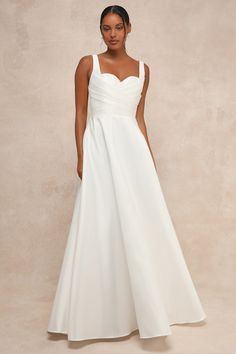 With a timeless silhouette and an undeniably romantic personality, the Lulus Modern Affection White Taffeta Pleated Sleeveless Maxi Dress is the perfect dress for your big day! Sleek and structured woven taffeta shapes wide straps that support a bodice with a classic sweetheart neckline, lightly padded cups, and a crisscrossing pleated design that lends a contemporary touch to this gorgeous dress. Fitted waist tops a full, ballgown-style skirt that has a layer of hidden tulle for volume. Low bac Classic Sleeveless Dress With Ruched Bodice, Sleeveless Wedding Dress With Princess Seams, Wedding Dress With Pleated And Fitted Bodice, Sweetheart Neckline, A-line Wedding Dress With Fitted Bodice, Sleeveless Taffeta Dress With Ruched Bodice, Sleeveless Wedding Dress With Pleated Back, Sleeveless Taffeta Dress With Fitted Bodice, Wedding Dress With Pleated Bodice And Sweetheart Neckline, Classic Wedding Dress With Ruched Bodice