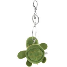 a green stuffed turtle keychain hanging from a chain on a white background with clippings