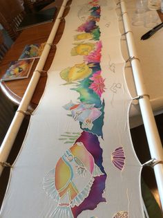 a long table with some artwork on it