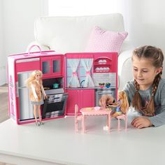 Warm up your child's imagination and take their doll play on the road with this convenient Badger Basket Home & Go Travel Kitchen Playset. This pop-up kitchen includes everything you need and features a built-in oven, fridge, and upper cabinet. It also includes an easy to assemble kitchen table with two dining chairs, plus additional accessories like pots, pans, plates, and silverware. The best part is the dining table, chairs, accessories plus three dolls conveniently store inside the travel ca Kitchen With Storage, Plates And Silverware, Travel Kitchen, Doll Kitchen, Kitchen Playset, Upper Cabinet, Fridge Storage, Table Chairs, Pots Pans