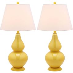 two yellow lamps sitting next to each other