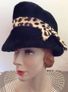 "Vintage 1950s 1960s Black hat with stenciled calfskin band. Made in Italy. CONDITION: No issues noted. INSIDE GROSSGRAIN BAND CIRCUMFERENCE-21\" INSIDE CIRCUMFERENCE JUST UNDER THE BRIM-25\" HEIGHT OF CROWN-4\" **WE APOLOGIZE~BUT WE CAN NO LONGER SHIP TO ITALY OR SPAIN. WE HAVE INCURRED TOO MANY ISSUES WITH SHIPPING. PACKAGES GOING MISSING..DAMAGED...ETC. IF ORDERS COME IN FROM ITALY OR SPAIN, WE WILL HAVE TO CANCEL THEM AND REFUND YOUR MONEY. SORRY FOR THIS INCONVENIENCE. BUT WE CAN NO LONGER Retro Wide Brim Cloche Hat For Winter, Fitted Vintage Cloche Hat For Vintage Events, Retro Formal Winter Hats, Vintage Brimmed Cloche Hat For Winter, Vintage Winter Brimmed Cloche Hat, Winter Vintage Brimmed Cloche Hat, Vintage Party Hats For Winter, Retro Cloche Hat With Curved Brim For Evening, Vintage Cloche Hat With Short Brim For Evening