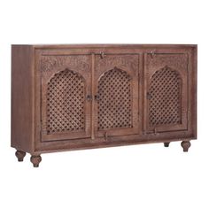 an old wooden cabinet with carved doors