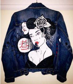 a jean jacket with an image of a woman on it