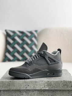 Embrace understated cool with these Air Jordan 4 Retro-inspired "Dark Grey" sneakers. This versatile colorway features a mix of premium grey tones across the upper, creating a sleek and sophisticated look. The iconic silhouette, with signature mesh netting and visible Air unit, delivers classic style and all-day comfort. Whether you're hitting the streets or the court, these sneakers are a must-have for any sneakerhead's collection. Gray Air Jordan 4 Streetwear Sneakers, Gray Air Jordan 4 Streetwear, Gray Air Jordan 4 For Streetwear, Gray Air Jordan 4 Sporty Streetwear, Gray Air Jordan 4 Casual Streetwear, Casual Gray Air Jordan 4 For Streetwear, Gray Low-top Air Jordan 4 For Streetwear, Modern Air Jordan 4 High-top For Sports, Modern High-top Air Jordan 4 For Sports