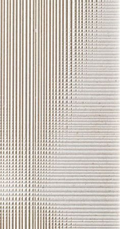 a white wall with vertical lines on it