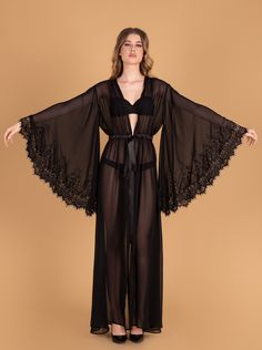 Ankle/floor-length seductive style with a long front slit starting at the waist. Sewn-in elastic waist belt ties into a sash. Material Composition: polyester 100% Pretty Nightgowns, White Bridal Robe, Silk Robe Long, Robe For Women, Lace Bridal Robe, Seductive Style, Luxury Robes, Sheer Robe, Peignoir Sets