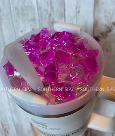 a blender filled with lots of purple colored rocks