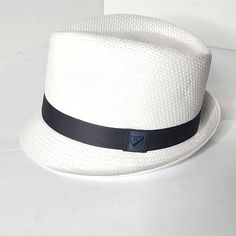 Solid Band Small Brim Fedora Silhouette Straw Cotton Fabrication Spot Clean New With Tags White Fitted Casual Hat, White Adjustable Panama Hat Casual Style, Casual White Brimmed Fedora, Casual Adjustable White Panama Hat, Casual White Adjustable Panama Hat, Casual White Panama Hat With Short Brim, Casual White Flat Brim Fedora, Casual White Fedora, Beach Bucket Hat