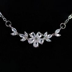 New to our Millennium collection, These beautiful romantic Swarovski Crystal Dainty Gilded Flora Serenade necklace are made of very fine quality of Swarovski crystals/ Cz diamonds and plated with platinum for your special day! Even we have hard time taking pictures because of their shine 😄 so we want to shine our brides on their special days. Simulated diamonds are also known as diamond simulants and include things like cubic zirconia (CZ), moissanite, and YAG. They can also include some natura Elegant Crystal Necklace With Delicate Chain For Party, Elegant Flower Necklace With Clavicle Chain For Party, Silver Flower Necklace With Clavicle Chain For Parties, Elegant Rhinestone Pendant Necklace With Adjustable Chain, Crystal Flower-shaped Necklaces For Parties, Elegant Crystal Necklace With Delicate Chain, Silver Flower-shaped Necklace For Parties, Crystal Necklaces With Clavicle Chain And Flower Pendant, Crystal Clavicle Chain Necklace With Flower Pendant