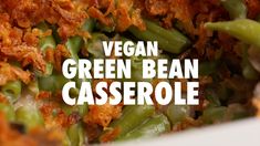 green bean casserole in a white bowl with the words vegan green bean casserole